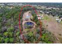 Aerial view of property highlighting home and pond at 14150 Manatee Rd, Parrish, FL 34219