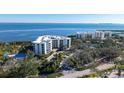 Aerial view showcasing the condo's waterfront location and surrounding landscape at 2110 Harbourside Dr # 522, Longboat Key, FL 34228