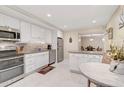 Modern kitchen with stainless steel appliances and granite countertops at 304 Pine Run Dr, Osprey, FL 34229