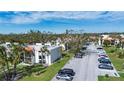 Complex of condo buildings with ample parking and green spaces at 3259 Beneva Rd # 102, Sarasota, FL 34232