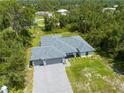 New construction home situated on a large lot with mature trees at 4892 Hillman Ter, North Port, FL 34288