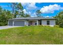 Charming new construction home with a large grassy yard at 4892 Hillman Ter, North Port, FL 34288