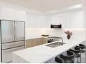 Modern kitchen with stainless steel appliances and marble counters at 4950 Remington Dr # 202A, Sarasota, FL 34234