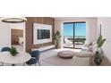 Bright living room with access to balcony and city views at 4950 Remington Dr # 202A, Sarasota, FL 34234