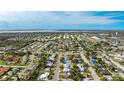 Wide aerial view showcasing the property's location within a residential neighborhood at 5706 10Th Avenue Dr W, Bradenton, FL 34209