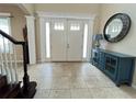 Bright and spacious entryway with double doors and high ceilings at 5718 Westhaven Cv, Bradenton, FL 34203