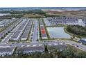 Aerial view showing townhome location near pond at 6111 Fairmont Ln, Palmetto, FL 34221