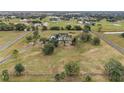 Aerial view showing a large farmhouse on a spacious lot with a long driveway at 639 Oakford Rd, Sarasota, FL 34240