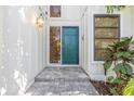 Green front door welcomes guests to this beautiful home at 752 Tropical Cir, Sarasota, FL 34242