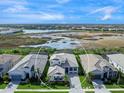 Luxury home community with preserve and lake views; single-Gathering home with tile roof at 8050 Redonda Loop, Lakewood Ranch, FL 34202