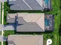 Luxury home with pool and spa; grey tile roof and paver driveway at 8050 Redonda Loop, Lakewood Ranch, FL 34202
