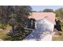 Single story home with tile roof and spacious driveway at 8282 Parkside Dr, Englewood, FL 34224