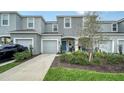 Two-story townhome with attached garage and manicured landscaping at 8533 Lunar Skye St, Sarasota, FL 34241