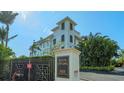 Exterior of Hudson Crossing, a waterfront community, showcasing its architecture and landscaping at 888 S Orange Ave # 3D, Sarasota, FL 34236