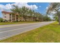 Front view of condo building, showcasing curb appeal at 104 Capri Isles Blvd # 112, Venice, FL 34292