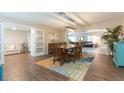 Spacious dining room with a large table and colorful area rug at 1110 2Nd S Ave, Tierra Verde, FL 33715