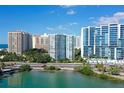 Aerial view of highrise building near waterfront, offering a luxurious living experience at 1111 N Gulfstream Ave # 3E, Sarasota, FL 34236