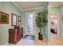 Bright entryway with decorative console table and view into the living area at 19451 Quisto St, Venice, FL 34293