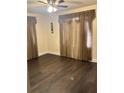 Spacious bedroom with dark hardwood floors and neutral walls at 3301 N Avenida Republica De Cuba, Tampa, FL 33605