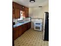Classic kitchen featuring wood cabinets and modern appliances at 3301 N Avenida Republica De Cuba, Tampa, FL 33605