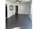 Bright living room with dark hardwood floors and lots of natural light at 3301 N Avenida Republica De Cuba, Tampa, FL 33605