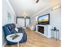 Comfortable living room with a fireplace, TV, and ample seating at 3333 26Th E Ave # 1241, Bradenton, FL 34208