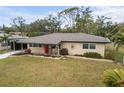 Single story home with a carport and well-manicured lawn at 3520 Belmont Blvd, Sarasota, FL 34232