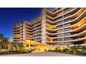 Elegant building entrance with landscaping and inviting ambiance at 415 L Ambiance Dr # C204, Longboat Key, FL 34228