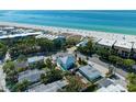 Aerial view showcasing a house near the beach with ocean access at 5613 Gulf Dr, Holmes Beach, FL 34217