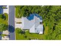 Single-story home with a large backyard and driveway at 5916 Bonaventure Pl, Sarasota, FL 34243