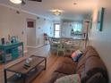 Bright living room featuring hardwood floors and comfy seating at 6033 34Th W St # 138, Bradenton, FL 34210