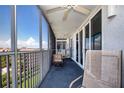 Screened balcony with patio furniture and ocean view at 6300 Midnight Pass Rd # 708, Sarasota, FL 34242