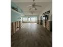 Spacious living area with tiled floors, currently under renovation at 890 N Shore Dr, Anna Maria, FL 34216