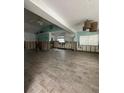 Large living room with tiled floors undergoing renovation at 890 N Shore Dr, Anna Maria, FL 34216