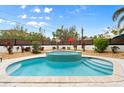 Relaxing backyard oasis with a turquoise pool and spa at 107 75Th St, Holmes Beach, FL 34217