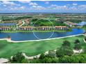 Aerial view showcasing the community's location and golf course at 17108 Vardon Ter # 203, Lakewood Ranch, FL 34211