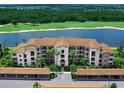 Luxury condo building with water and golf course views at 17108 Vardon Ter # 203, Lakewood Ranch, FL 34211