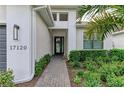 Brick pathway leads to the front entrance with a modern door at 17120 Cresswind Ter, Bradenton, FL 34211