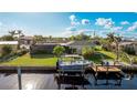 Backyard with canal access, private dock, and boat lift at 181 Beeney Se Rd, Port Charlotte, FL 33952