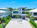 Luxury waterfront home with spacious driveway and modern design at 1914 Riverside E Dr, Bradenton, FL 34208