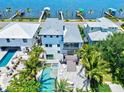 Stunning waterfront home featuring pool, patio, and lush landscaping at 1914 Riverside E Dr, Bradenton, FL 34208