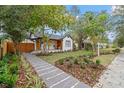 Landscaped front yard with walkway leading to a renovated bungalow at 4536 1St N Ave, St Petersburg, FL 33713