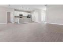 Open concept kitchen features island and modern appliances at 5587 Farmington Ave, North Port, FL 34288