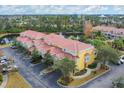 Aerial view of townhome community near a lake at 5700 Bentgrass Dr # 16-211, Sarasota, FL 34235