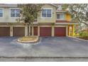 Townhome with attached garage and landscaping at 5700 Bentgrass Dr # 16-211, Sarasota, FL 34235
