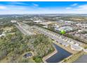 Community overview with houses, pond, and green spaces at 6077 Amberly Dr, Bradenton, FL 34208