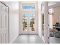 Bright and spacious entryway with double doors leading to the backyard at 6702 Pinehurst Pl, Bradenton, FL 34202