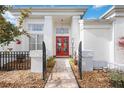 Inviting entryway with red double doors and a stone pathway at 6702 Pinehurst Pl, Bradenton, FL 34202