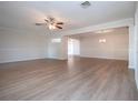 Spacious living room with light walls and wood-look floors at 7213 Las Casas Dr, Sarasota, FL 34243