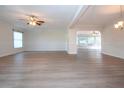 Spacious living room with light walls and wood-look floors at 7213 Las Casas Dr, Sarasota, FL 34243